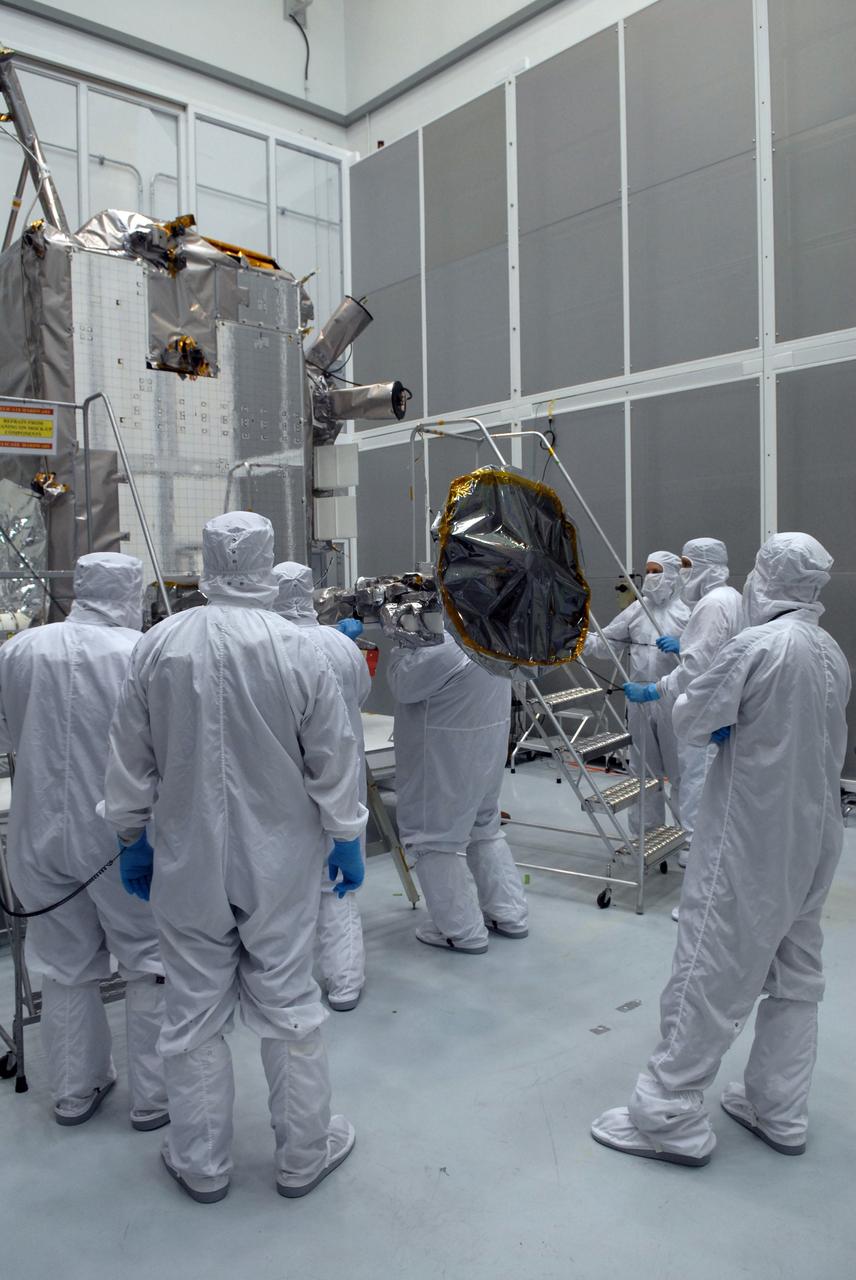 CAPE CANAVERAL, Fla. – At Astrotech Space Operations in Titusville, Fla., technicians begin stowing NASA's Lunar Reconnaissance Orbiter's high-gain antenna.  The antenna completed a range of motion test. The orbiter will carry seven instruments to provide scientists with detailed maps of the lunar surface and enhance our understanding of the moon's topography, lighting conditions, mineralogical composition and natural resources. Information gleaned from LRO will be used to select safe landing sites, determine locations for future lunar outposts and help mitigate radiation dangers to astronauts.  Launch of LRO is targeted no earlier than June 2.   Photo credit: NASA/Jack Pfaller
