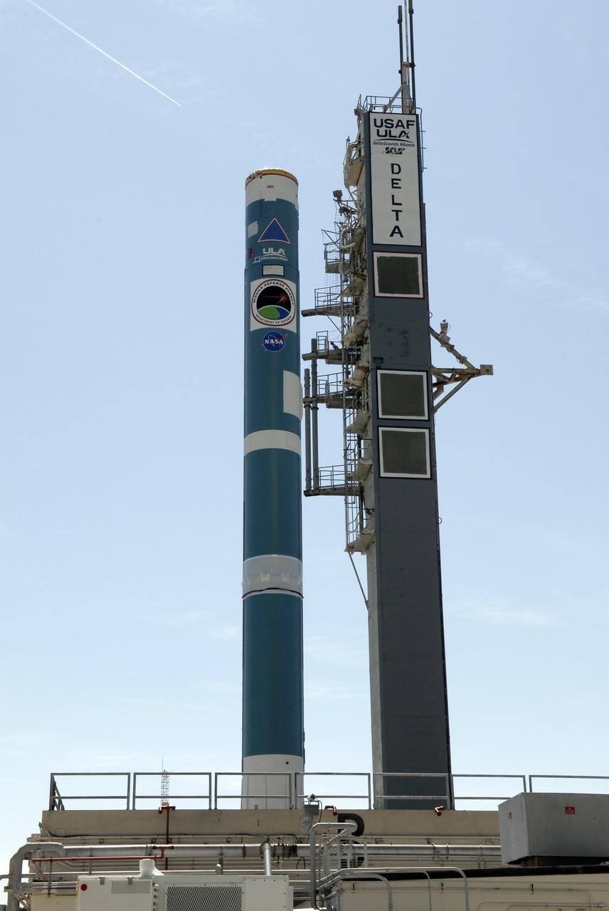 CAPE CANAVERAL, Fla. – On Launch Complex 17-B at Cape Canaveral Air Force Station, the first stage of the Delta II rocket waits on the gantry for the solid rocket boosters. The STSS Demonstrators is a midcourse tracking technology demonstrator and is part of an evolving ballistic missile defense system. STSS is capable of tracking objects after boost phase and provides trajectory information to other sensors. It will be launched by NASA for the Missile Defense Agency on July 29. Photo credit: NASA/Kim Shiflett