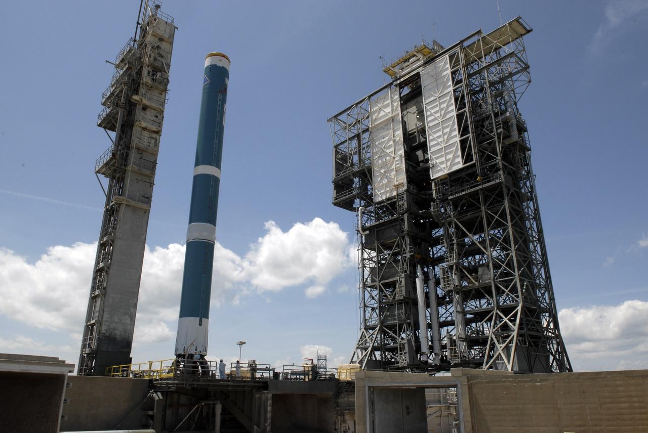 CAPE CANAVERAL, Fla. – On Launch Complex 17-B at Cape Canaveral Air Force Station, the mobile service tower at right moves toward the first stage of the Delta II rocket. The boosters in the tower will be attached to the rocket for launch of the STSS Demonstrator spacecraft. The STSS Demonstrators is a midcourse tracking technology demonstrator and is part of an evolving ballistic missile defense system. STSS is capable of tracking objects after boost phase and provides trajectory information to other sensors. It will be launched by NASA for the Missile Defense Agency on July 29. Photo credit: NASA/Kim Shiflett