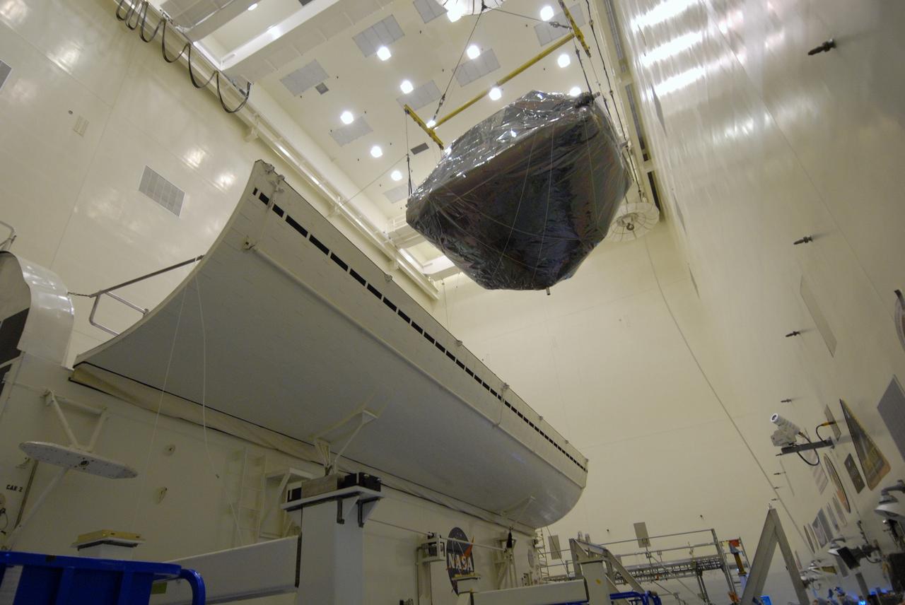 CAPE CANAVERAL, Fla. – In the Payload Hazardous Servicing Facility at NASA's Kennedy Space Center in Florida,  an overhead crane moves the Flight Support System, or FSS, carrier with the Soft Capture Mechanism toward the payload canister. The canister will deliver the FSS and other carriers to Launch Pad 39A for installation in space shuttle Atlantis' payload bay.  Atlantis' 11-day STS-125 mission to service NASA's Hubble Space Telescope is targeted for launch May 12.  It will include five spacewalks in which astronauts will refurbish and upgrade the telescope with state-of-the-art science instruments. As a result, Hubble's capabilities will be expanded and its operational lifespan extended through at least 2014.  Photo credit: NASA/Jack Pfaller