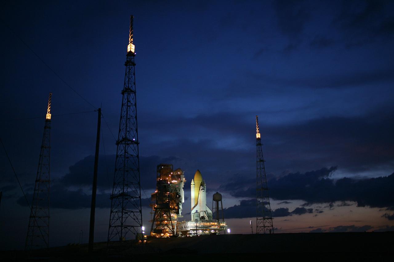 CAPE CANAVERAL, Fla. – Just before dawn, space shuttle Endeavour is bathed in xenon lights after being  secured on Launch Pad 39B at NASA's Kennedy Space Center in Florida.   First motion on rollout from the Vehicle Assembly Building was at 11:57 p.m. EDT April 16.  Surrounding the pad are the new lightning towers erected for NASA's Constellation Program, which will use the pad for Ares rocket launches.  Endeavour will be prepared on the pad for liftoff in the unlikely event that a rescue mission is necessary following space shuttle Atlantis' launch on the STS-125 mission to service NASA's  Hubble Space Telescope. After Atlantis is cleared to land, Endeavour will move to Launch Pad 39A for its upcoming STS-127 mission to the International Space Station, targeted to launch June 13.  Photo credit: NASA/Dimitri Gerondidakis