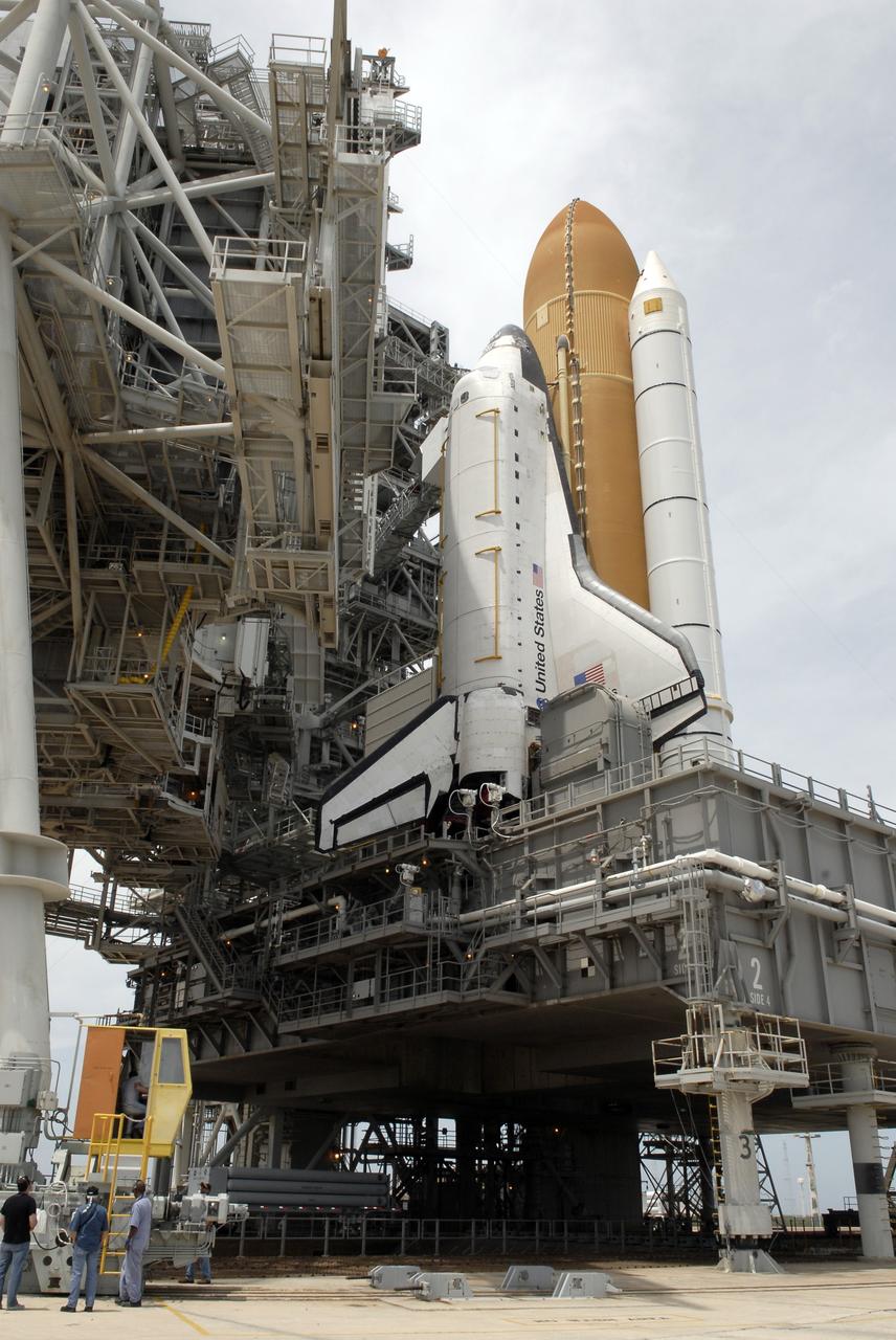 CAPE CANAVERAL, Fla. – On Launch Pad 39A at NASA's Kennedy Space Center in Florida, the rotating service structure around space shuttle Atlantis begins to open to enable delivery and transfer of Atlantis' payload on April 18. After space shuttle Endeavour's rollout to Launch pad 39B at NASA's Kennedy Space Center in Florida this morning, two different shuttles now are poised on two different launch pads in full view. With the space shuttle fleet set for retirement in 2010, this is expected to be the final time two shuttles will be on launch pads at the same time. Endeavour will stand by at pad B in the unlikely event that a rescue mission is necessary during space shuttle Atlantis' upcoming mission. Atlantis is targeted to launch May 12. After Endeavour is cleared from its duty as a rescue spacecraft, it will be moved to Launch Pad 39A for its STS-127 mission to the International Space Station. That flight is targeted for launch June 13. Photo credit: NASA/Kim Shiflett