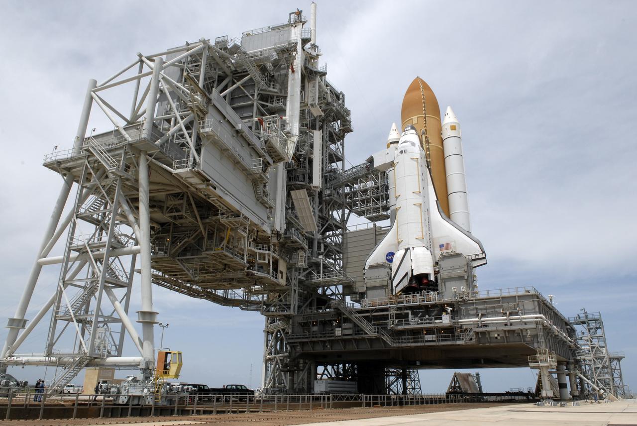 CAPE CANAVERAL, Fla. – On Launch Pad 39A at NASA's Kennedy Space Center in Florida, the rotating service structure around space shuttle Atlantis has been rolled back to enable delivery and transfer of Atlantis' payload on April 18. After space shuttle Endeavour's rollout to Launch pad 39B at NASA's Kennedy Space Center in Florida this morning, two different shuttles now are poised on two different launch pads in full view.  Near the top of the  shuttle is the White Room at the end of the orbiter access arm, 147 feet above the pad. When in place against the shuttle, the White Room provides access into the crew compartment on the shuttle.  With the space shuttle fleet set for retirement in 2010, this is expected to be the final time two shuttles will be on launch pads at the same time.  Endeavour will stand by at pad B in the unlikely event that a rescue mission is necessary during space shuttle Atlantis' upcoming mission. Atlantis is targeted to launch May 12. After Endeavour is cleared from its duty as a rescue spacecraft, it will be moved to Launch Pad 39A for its STS-127 mission to the International Space Station. That flight is targeted for launch June 13.    Photo credit: NASA/Kim Shiflett