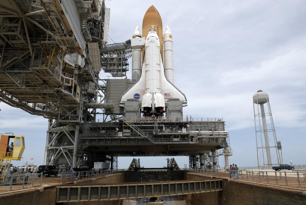 CAPE CANAVERAL, Fla. – On Launch Pad 39A at NASA's Kennedy Space Center in Florida, the rotating service structure around space shuttle Atlantis has been rolled back to enable delivery and transfer of Atlantis' payload on April 18. After space shuttle Endeavour's rollout to Launch pad 39B at NASA's Kennedy Space Center in Florida this morning, two different shuttles now are poised on two different launch pads in full view.  Near the top of the  shuttle is the White Room at the end of the orbiter access arm, 147 feet above the pad. When in place against the shuttle, the White Room provides access into the crew compartment on the shuttle. With the space shuttle fleet set for retirement in 2010, this is expected to be the final time two shuttles will be on launch pads at the same time.  Endeavour will stand by at pad B in the unlikely event that a rescue mission is necessary during space shuttle Atlantis' upcoming mission. Atlantis is targeted to launch May 12. After Endeavour is cleared from its duty as a rescue spacecraft, it will be moved to Launch Pad 39A for its STS-127 mission to the International Space Station. That flight is targeted for launch June 13.    Photo credit: NASA/Kim Shiflett