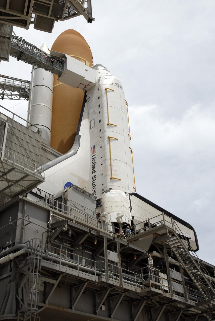 CAPE CANAVERAL, Fla. – On Launch Pad 39A at NASA's Kennedy Space Center in Florida, the rotating service structure around space shuttle Atlantis has been rolled back to enable delivery and transfer of Atlantis' payload on April 18. After space shuttle Endeavour's rollout to Launch pad 39B at NASA's Kennedy Space Center in Florida this morning, two different shuttles now are poised on two different launch pads in full view.  Near the top of the  shuttle is the White Room at the end of the orbiter access arm, 147 feet above the pad. When in place against the shuttle, the White Room provides access into the crew compartment on the shuttle. With the space shuttle fleet set for retirement in 2010, this is expected to be the final time two shuttles will be on launch pads at the same time.  Endeavour will stand by at pad B in the unlikely event that a rescue mission is necessary during space shuttle Atlantis' upcoming mission. Atlantis is targeted to launch May 12. After Endeavour is cleared from its duty as a rescue spacecraft, it will be moved to Launch Pad 39A for its STS-127 mission to the International Space Station. That flight is targeted for launch June 13.    Photo credit: NASA/Kim Shiflett