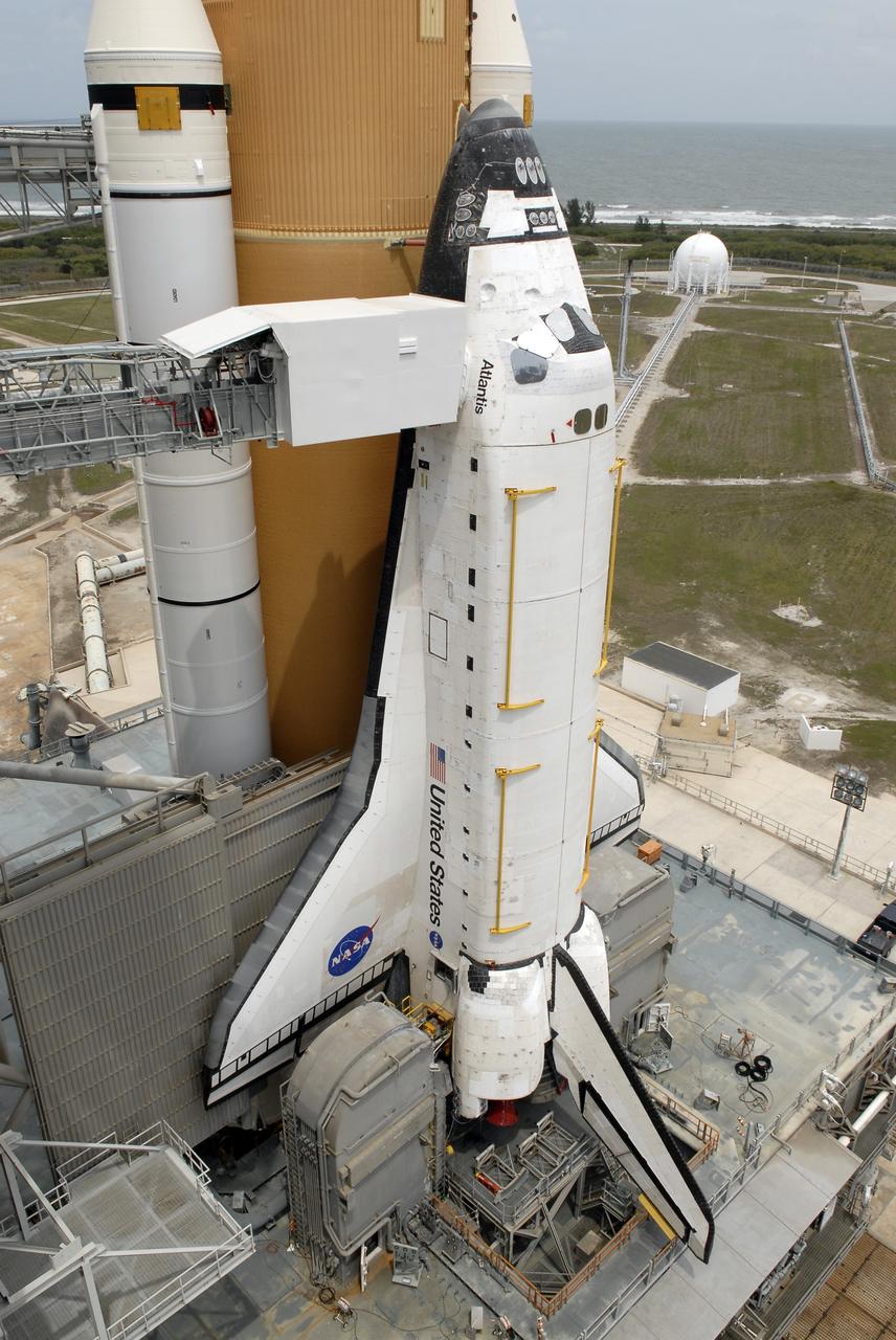 CAPE CANAVERAL, Fla. – On Launch Pad 39A at NASA's Kennedy Space Center in Florida, the rotating service structure around space shuttle Atlantis has been rolled back to enable delivery and transfer of Atlantis' payload on April 18. After space shuttle Endeavour's rollout to Launch pad 39B at NASA's Kennedy Space Center in Florida this morning, two different shuttles now are poised on two different launch pads in full view.  Near the top of the  shuttle is the White Room at the end of the orbiter access arm, 147 feet above the pad. When in place against the shuttle, the White Room provides access into the crew compartment on the shuttle.  With the space shuttle fleet set for retirement in 2010, this is expected to be the final time two shuttles will be on launch pads at the same time.  Endeavour will stand by at pad B in the unlikely event that a rescue mission is necessary during space shuttle Atlantis' upcoming mission. Atlantis is targeted to launch May 12. After Endeavour is cleared from its duty as a rescue spacecraft, it will be moved to Launch Pad 39A for its STS-127 mission to the International Space Station. That flight is targeted for launch June 13.    Photo credit: NASA/Kim Shiflett