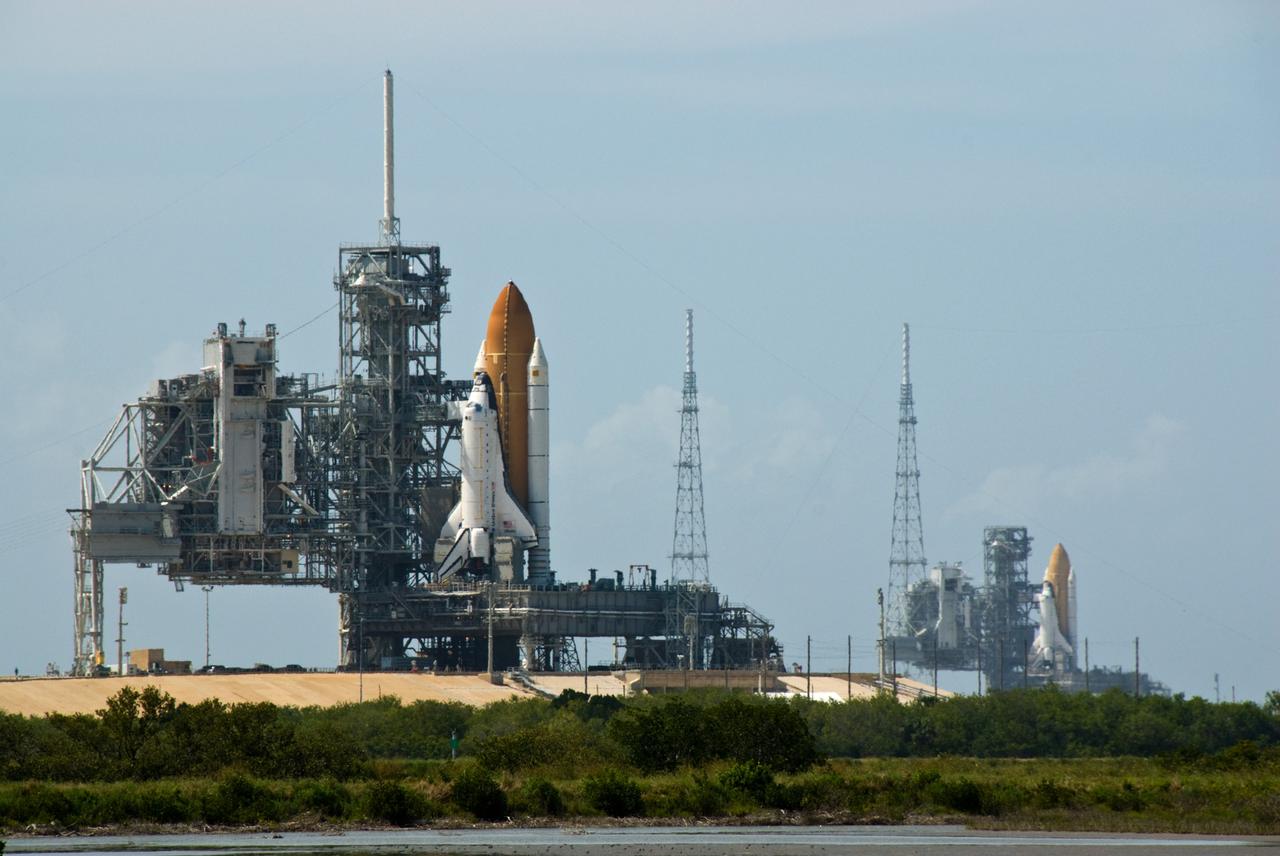 CAPE CANAVERAL, Fla. –– At NASA's Kennedy Space Center in Florida, space shuttles Atlantis (left) and Endeavour (right) are seen on Launch Pad 39A and 39B respectively. With the space shuttle fleet set for retirement in 2010, this is expected to be the final time two shuttles will be on launch pads at the same time. Endeavour will stand by at pad B in the unlikely event that a rescue mission is necessary during Atlantis' upcoming mission to upgrade NASA's Hubble Space Telescope. Atlantis is targeted to launch May 12. After Endeavour is cleared from its duty as a rescue spacecraft, it will be moved to Launch Pad 39A for its STS-127 mission to the International Space Station. That flight is targeted for launch June 13. Photo credit: NASA/Kim Shiflett