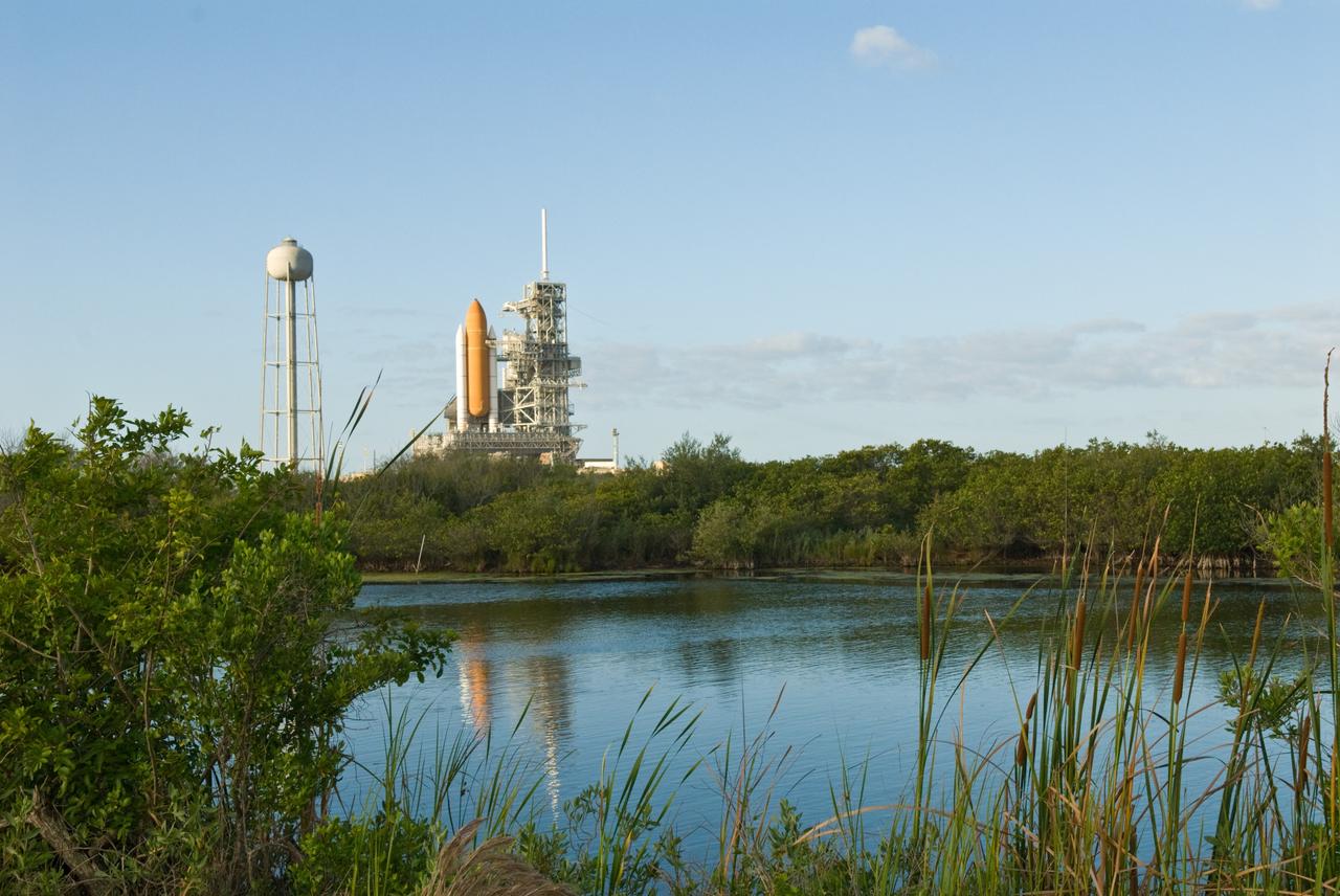 CAPE CANAVERAL, Fla. –– Space shuttle Atlantis on Launch Pad 39A is viewed across the lagoon at NASA's Kennedy Space Center in Florida. Atlantis is targeted to launch May 12 on the STS-125 mission to upgrade NASA's Hubble Space Telescope. Endeavour will be prepared on the pad for liftoff in the unlikely event that a rescue mission is necessary following space shuttle Atlantis' launch May 12 on the STS-125 mission to upgrade NASA's Hubble Space Telescope. After Atlantis is cleared to land, Endeavour will move to Launch Pad 39A for its upcoming STS-127 mission to the International Space Station, targeted to launch June 13. Photo credit: NASA/Jack Pfaller