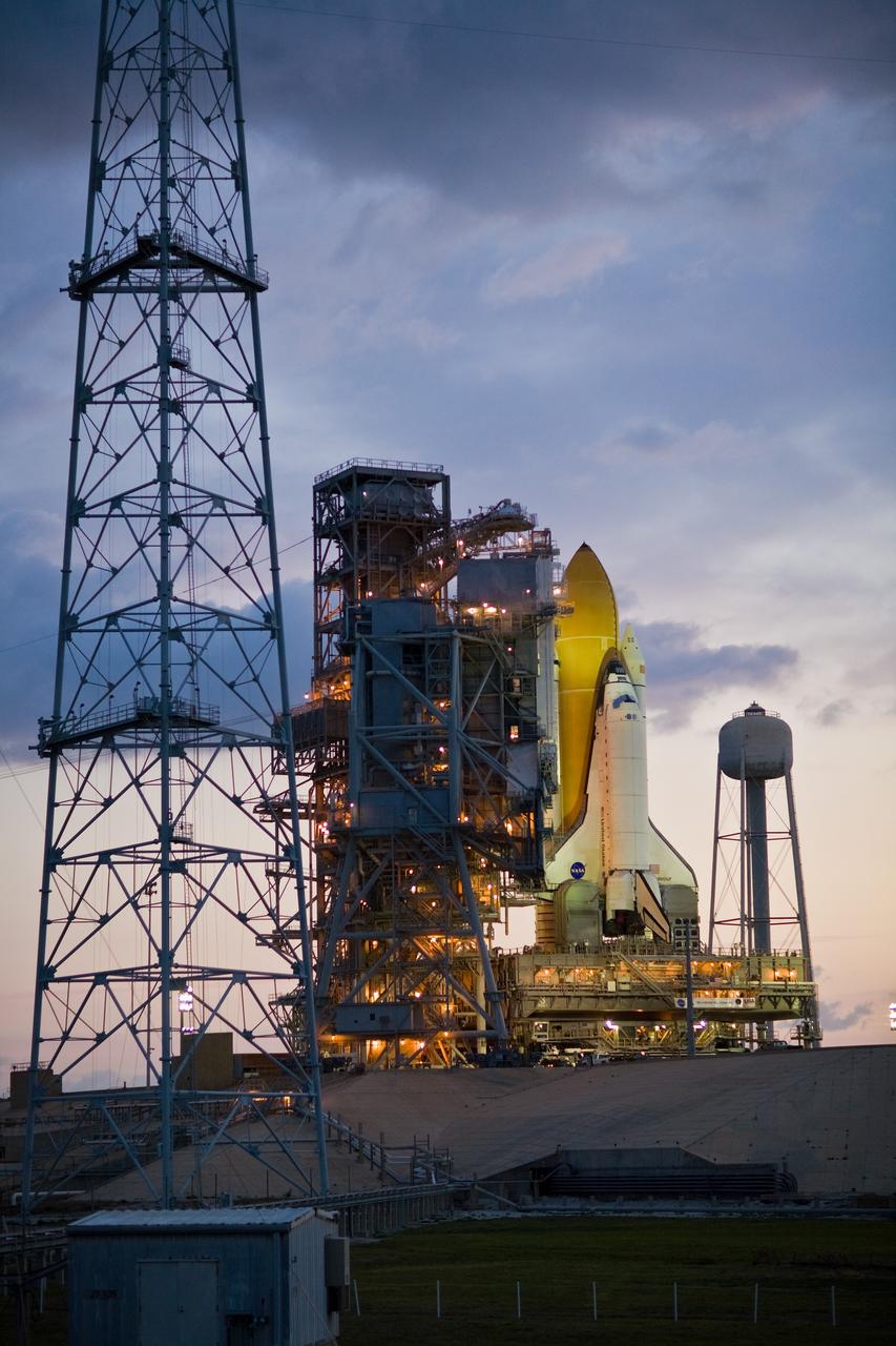 CAPE CANAVERAL, Fla. –– Under a dawn sky, space shuttle Endeavour is still bathed in light from the fixed service structure. Endeavour  joins Atlantis, which is on Launch Pad 39A at NASA's Kennedy Space Center in Florida. The towers around the launch pad were erected for NASA's Constellation Program, which will use the pad for Ares rocket launches.  With the space shuttle fleet set for retirement in 2010, this is expected to be the final time two shuttles will be on launch pads at the same time.  Endeavour will be prepared on the pad for liftoff in the unlikely event that a rescue mission is necessary following space shuttle Atlantis' launch on the STS-125 mission to service NASA's  Hubble Space Telescope. After Atlantis is cleared to land, Endeavour will move to Launch Pad 39A for its upcoming STS-127 mission to the International Space Station, targeted to launch June 13.  Photo credit: NASA/Dimitri Gerondidakis