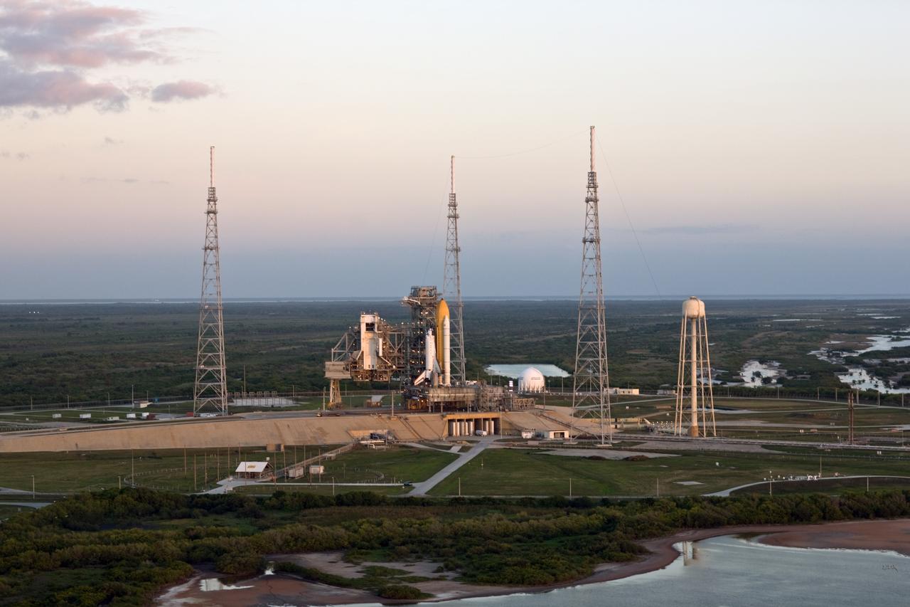 CAPE CANAVERAL, Fla. –– Early morning light falls on space shuttle Endeavour on Launch Pad 39B at NASA's Kennedy Space Center in Florida. It joins space shuttle Atlantis on Launch Pad 39A. This is probably the final time two shuttles will be on launch pads at the same time with the space shuttle fleet set for retirement in 2010. Endeavour will be prepared on the pad for liftoff in the unlikely event that a rescue mission is necessary following space shuttle Atlantis' launch on the STS-125 mission to service NASA's Hubble Space Telescope. After Atlantis is cleared to land, Endeavour will move to Launch Pad 39A for its upcoming STS-127 mission to the International Space Station, targeted to launch June 13. Photo credit: NASA/Dimitri Gerondidakis