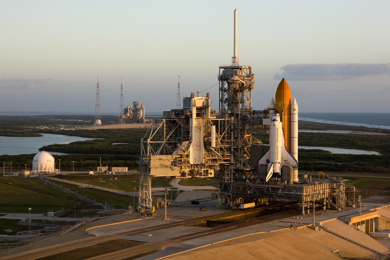 CAPE CANAVERAL, Fla. –– Space shuttle Endeavour (left) and space shuttle Atlantis are seen on Launch Pads 39B and 39A, respectively, at NASA's Kennedy Space Center in Florida. This is probably the final time two shuttles will be on launch pads at the same time with the space shuttle fleet set for retirement in 2010. Endeavour will be prepared on the pad for liftoff in the unlikely event that a rescue mission is necessary following space shuttle Atlantis' launch on the STS-125 mission to service NASA's Hubble Space Telescope. After Atlantis is cleared to land, Endeavour will move to Launch Pad 39A for its upcoming STS-127 mission to the International Space Station, targeted to launch June 13. Photo credit: NASA/Dimitri Gerondidakis