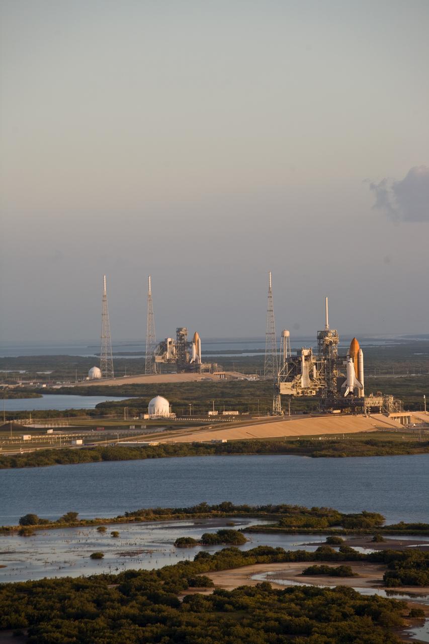 CAPE CANAVERAL, Fla. –– On Launch Pad 39B (left) at NASA's Kennedy Space Center in Florida, space shuttle Endeavour has joined space shuttle Atlantis on Launch Pad 39A (right). This is probably the final time two shuttles will be on launch pads at the same time with the space shuttle fleet set for retirement in 2010. Surrounding pad 39B are the lightning towers erected for NASA's Constellation Program, which will use the pad for Ares rocket launches. Endeavour will be prepared on the pad for liftoff in the unlikely event that a rescue mission is necessary following space shuttle Atlantis' launch on the STS-125 mission to service NASA's Hubble Space Telescope. After Atlantis is cleared to land, Endeavour will move to Launch Pad 39A for its upcoming STS-127 mission to the International Space Station, targeted to launch June 13. Photo credit: NASA/Dimitri Gerondidakis