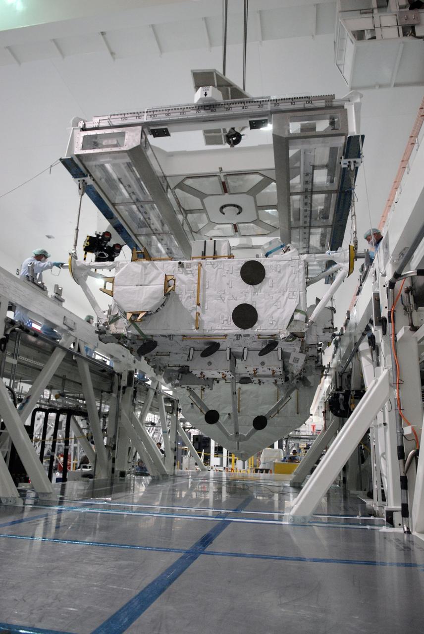 CAPE CANAVERAL, Fla. –– In the Space Station Processing Facility at NASA's Kennedy Space Center in Florida, the suspended Japan Aerospace Exploration Agency's Kibo Exposed Facility, or EF, is lowered into a workstand. When it is installed on the Kibo laboratory, the EF will provide a multipurpose platform where science experiments can be deployed and operated in the exposed environment. The payloads attached to the EF can be exchanged or retrieved by Kibo's robotic arm, the JEM Remote Manipulator System. The EF, along with the Experiment Logistics Module Exposed Section, will be carried aboard space shuttle Endeavour on the STS-127 mission targeted for launch June 13, 2009. Photo credit: NASA/Kim Shiflett