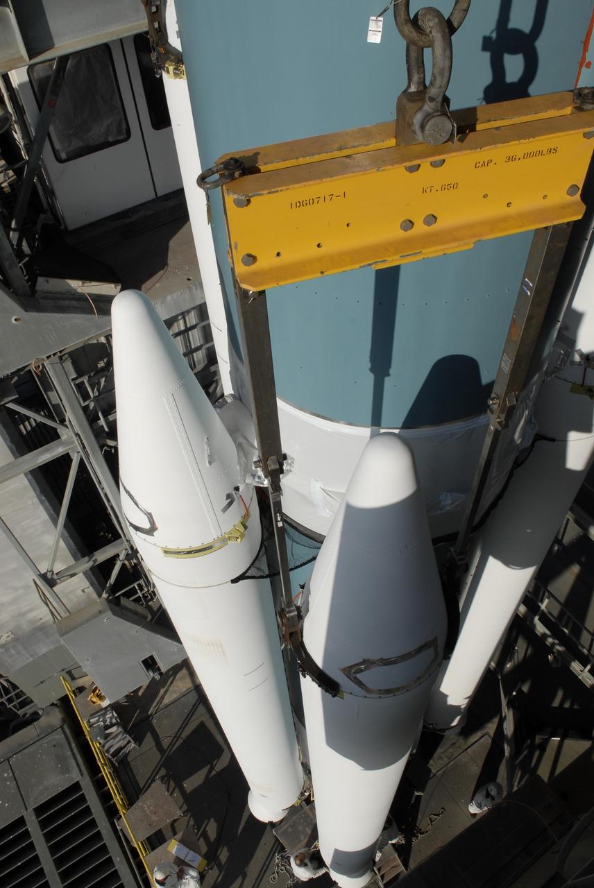 CAPE CANAVERAL, Fla. – On Launch Pad 17-B at Cape Canaveral Air Force Station, solid rocket boosters are attached to a Delta II rocket for launch of the STSS Demonstrator spacecraft. The spacecraft is a midcourse tracking technology demonstrator, part of an evolving ballistic missile defense system. STSS is capable of tracking objects after boost phase and provides trajectory information to other sensors. It will be launched by NASA for the Missile Defense Agency on July 29. Photo credit: NASA/Kim Shiflett