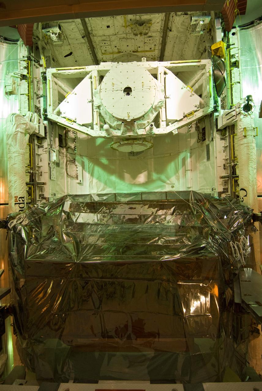 CAPE CANAVERAL, Fla. –– On Launch Pad 39A at NASA's Kennedy Space Center in Florida, the equipment and hardware needed to service the Hubble Space Telescope are installed into space shuttle Atlantis' payload bay. Launch of Atlantis' 11-day STS-125 mission to Hubble is targeted for May 12. The flight will include five spacewalks during which astronauts will refurbish and upgrade the telescope with state-of-the-art science instruments. As a result, Hubble's capabilities will be expanded and its operational lifespan extended through at least 2014. Photo credit: NASA/Jack Pfaller