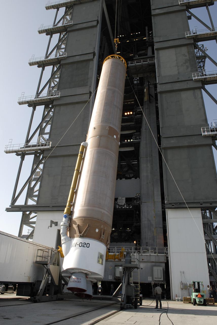 CAPE CANAVERAL, Fla. –– When the Atlas V first stage is raised to vertical, it will be lifted into the Vertical Integration Facility on Cape Canaveral Air Force Station's Launch Complex 41. The Atlas V/Centaur is the launch vehicle for the Lunar Reconnaissance Orbiter, or LRO. The orbiter will carry seven instruments to provide scientists with detailed maps of the lunar surface and enhance our understanding of the moon's topography, lighting conditions, mineralogical composition and natural resources. Information gleaned from LRO will be used to select safe landing sites, determine locations for future lunar outposts and help mitigate radiation dangers to astronauts. Launch of LRO is targeted no earlier than June 2.  Photo credit: NASA/Kim Shiflett