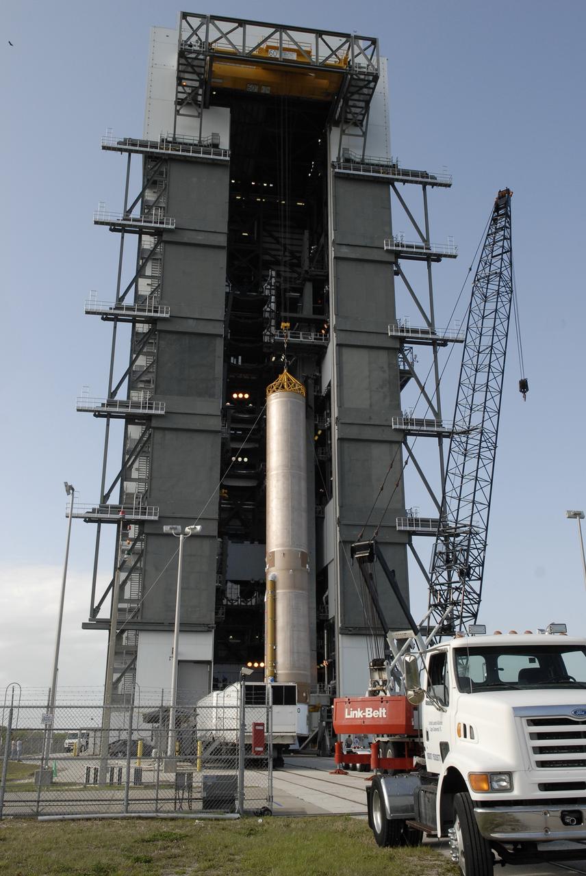 CAPE CANAVERAL, Fla. –– On Cape Canaveral Air Force Station's Launch Complex 41, the Atlas V first stage is being moved into the Vertical Integration Facility. The Atlas V/Centaur is the launch vehicle for the Lunar Reconnaissance Orbiter, or LRO. The orbiter will carry seven instruments to provide scientists with detailed maps of the lunar surface and enhance our understanding of the moon's topography, lighting conditions, mineralogical composition and natural resources. Information gleaned from LRO will be used to select safe landing sites, determine locations for future lunar outposts and help mitigate radiation dangers to astronauts. Launch of LRO is targeted no earlier than June 2.  Photo credit: NASA/Kim Shiflett