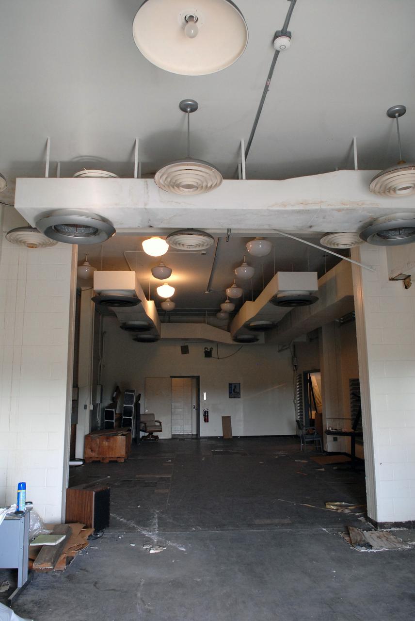 CAPE CANAVERAL, Fla. – Furniture and equipment is being moved out of the 50-year-old Mission Control Center on the Cape Canaveral Air Force Station in Florida. Out of use for many years, and with no valid operational or other use for the facility, NASA plans to demolish the site. The facility once controlled all manned Mercury space flights and the first two unmanned Gemini flights from May 1961-1963. It provided launch, orbital, re-entry and landing control for the flights. That function was later transferred to NASA's Johnson Space Center in Houston. Photo credit: NASA/Jack Pfaller