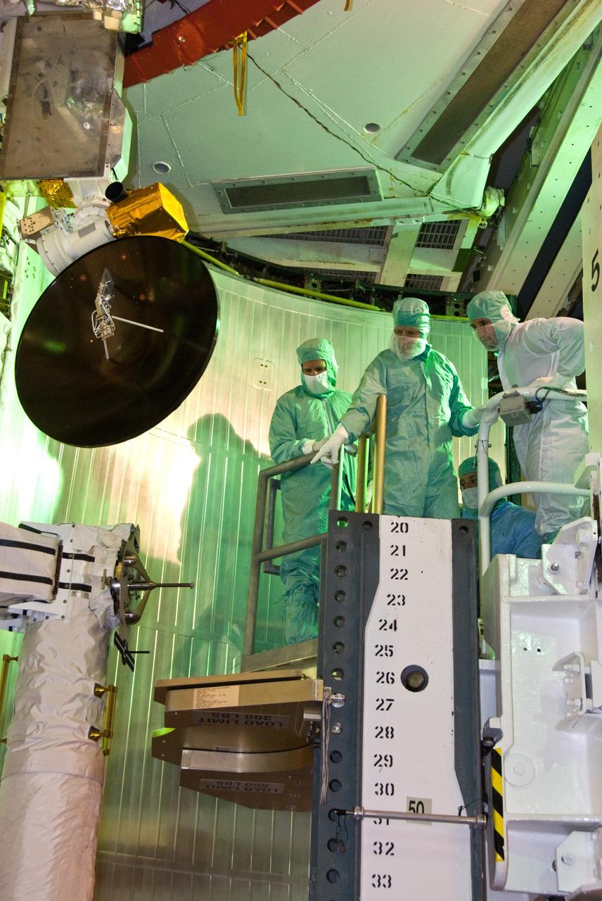 CAPE CANAVERAL, Fla. –– In space shuttle Atlantis' payload bay at NASA Kennedy Space Center's Launch Pad 39A, STS-125 crew members take a final close look at the hardware for the Hubble servicing mission before the targeted May 11 launch. From left are Mission Specialist John Grunsfeld, Pilot Gregory C. Johnson and (kneeling) Mission Specialist Mike Massimino. Atlantis' 11-day mission will include five spacewalks to refurbish and upgrade the telescope with state-of-the-art science instruments. The payload bay holds four carriers of equipment that include the Wide Field Camera 3, Cosmic Origins Spectrograph, the Soft Capture Mechanism and replacement gyroscopes and batteries. As a result, Hubble's capabilities will be expanded and its operational lifespan extended through at least 2014. Photo credit: NASA/Kim Shiflett