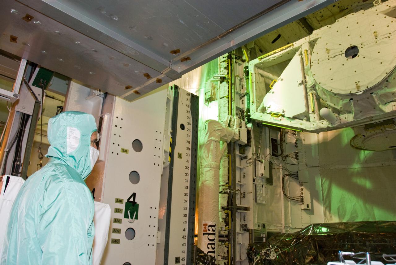 CAPE CANAVERAL, Fla. –– In space shuttle Atlantis' payload bay at NASA Kennedy Space Center's Launch Pad 39A, STS-125 Mission Specialist Michael Good takes a final close look at the hardware for the Hubble servicing mission before the targeted May 11 launch. Atlantis' 11-day mission will include five spacewalks to refurbish and upgrade the telescope with state-of-the-art science instruments. The payload bay holds four carriers of equipment that include the Wide Field Camera 3, Cosmic Origins Spectrograph, the Soft Capture Mechanism and replacement gyroscopes and batteries. As a result, Hubble's capabilities will be expanded and its operational lifespan extended through at least 2014. Photo credit: NASA/Kim Shiflett