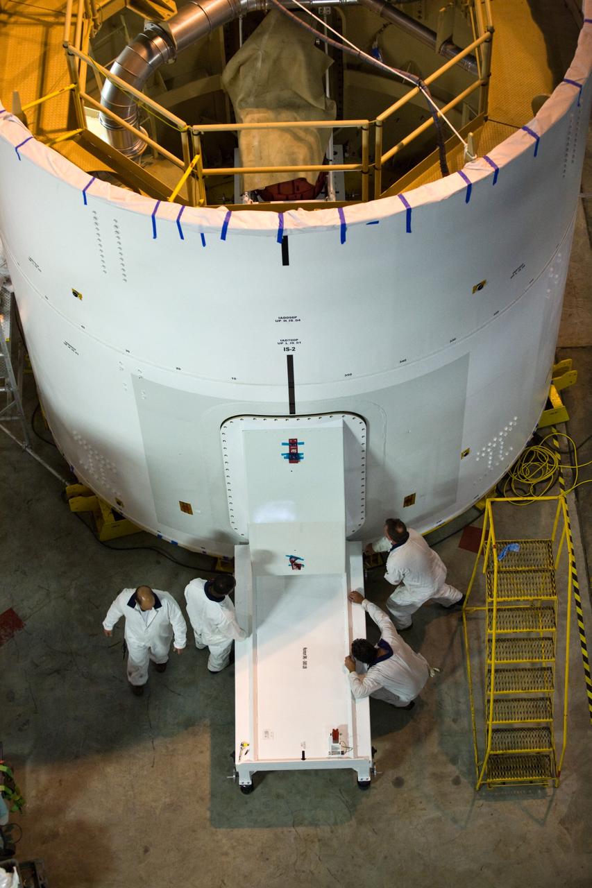 CAPE CANAVERAL, Fla. –– In High Bay 4 of the Vehicle Assembly Building at NASA's Kennedy Space Center in Florida, technicians complete installation of a second roll control system module in an Ares I-X segment. Ares I-X is the test vehicle for the Ares I, which is part of the Constellation Program to return men to the moon and beyond. Ares I-X is targeted for launch in August 2009. Photo credit: NASA/Dimitri Gerondidakis
