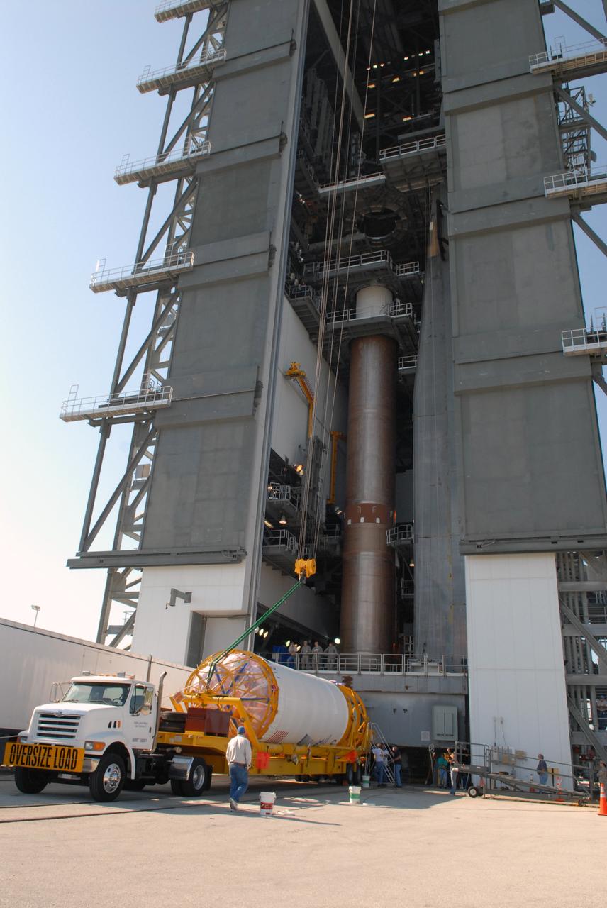 CAPE CANAVERAL, Fla. –– On Cape Canaveral Air Force Station's Launch Complex 41, cranes are attached to the Centaur upper stage in order to raise it to vertical.  It will be lifted into the Vertical Integration Facility for installation onto the Atlas V first stage, already in the tower.  The Atlas V/Centaur is the launch vehicle for NASA's Lunar Reconnaissance Orbiter, or LRO, and NASA's Lunar CRater Observation and Sensing Satellite, known as LCROSS.  LCROSS and LRO are the first missions in NASA's plan to return humans to the moon and begin establishing a lunar outpost by 2020.  Photo credit: NASA/Jack Pfaller