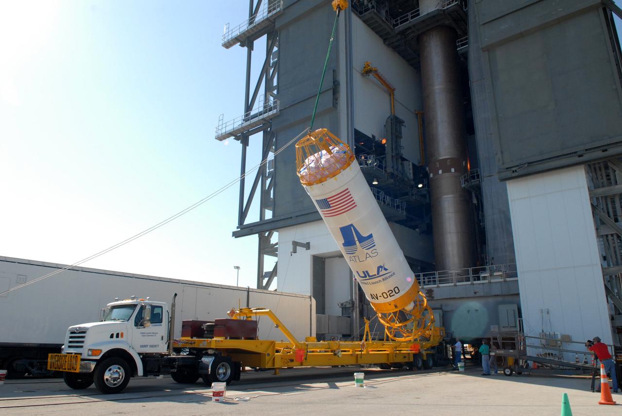 CAPE CANAVERAL, Fla. –– On Cape Canaveral Air Force Station's Launch Complex 41, the Centaur upper stage is raised from its transporter.  When it is vertical, it will be lifted into the Vertical Integration Facility for installation onto the Atlas V first stage, already in the tower. The Atlas V/Centaur is the launch vehicle for NASA's Lunar Reconnaissance Orbiter, or LRO, and NASA's Lunar CRater Observation and Sensing Satellite, known as LCROSS.  LCROSS and LRO are the first missions in NASA's plan to return humans to the moon and begin establishing a lunar outpost by 2020.  Photo credit: NASA/Jack Pfaller