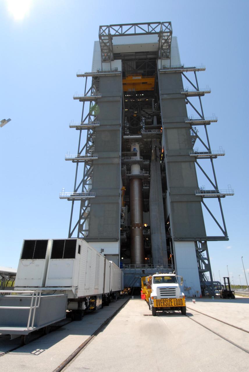 CAPE CANAVERAL, Fla. –– On Cape Canaveral Air Force Station's Launch Complex 41, the Centaur upper stage is moved into place in the Vertical Integration Facility for installation onto the Atlas V first stage, seen below it.  The Atlas V/Centaur is the launch vehicle for NASA's Lunar Reconnaissance Orbiter, or LRO, and NASA's Lunar CRater Observation and Sensing Satellite, known as LCROSS.  LCROSS and LRO are the first missions in NASA's plan to return humans to the moon and begin establishing a lunar outpost by 2020.  Photo credit: NASA/Jack Pfaller
