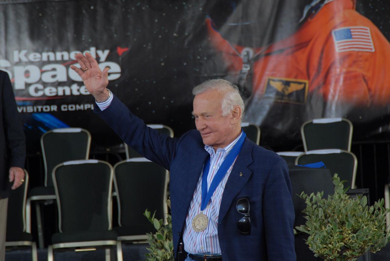 CAPE CANAVERAL, Fla. –– Hall of Fame astronaut Buzz Aldrin thanks the audience for its applause at the 2009 U.S. Astronaut Hall of Fame induction ceremony at NASA's Kennedy Space Center Visitor Complex in Florida. The ceremony took place May 2. More than 20 hall of fame astronauts attended, including Scott Carpenter, Walt Cunningham, Jim Lovell and Bob Crippen. Photo credit: NASA/Jim Grossmann