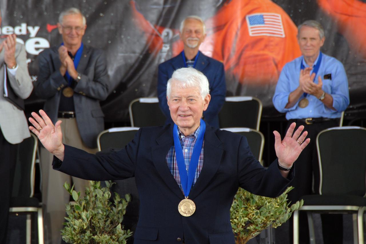 CAPE CANAVERAL, Fla. –– Hall of Fame astronaut Hank Hartsfield thanks the audience for its applause at the 2009 U.S. Astronaut Hall of Fame induction ceremony at NASA's Kennedy Space Center Visitor Complex in Florida. The ceremony took place May 2. More than 20 hall of fame astronauts attended, including Scott Carpenter, Walt Cunningham, Jim Lovell and Bob Crippen. Photo credit: NASA/Jim Grossmann