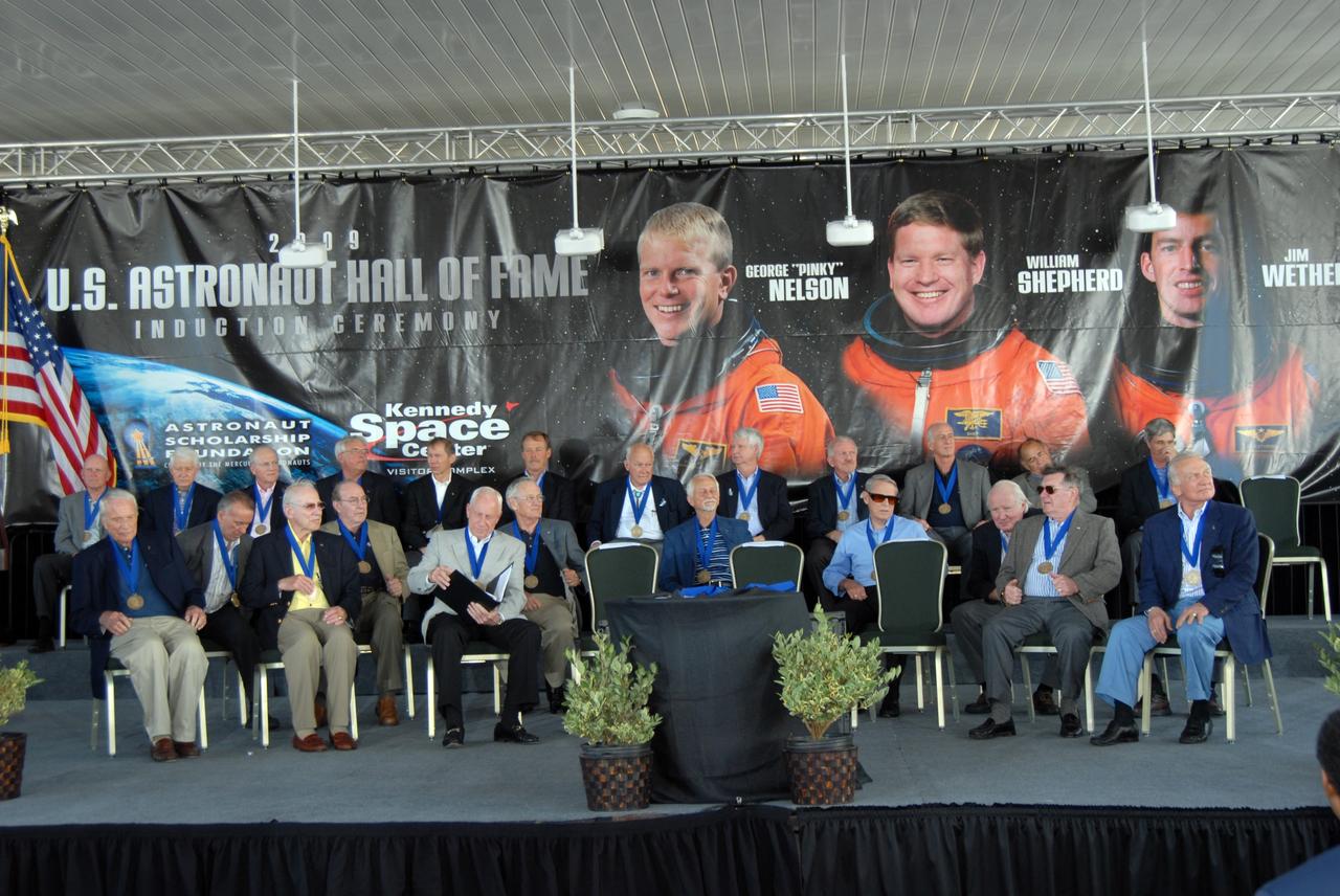 CAPE CANAVERAL, Fla. –– U.S. Astronaut Hall of Fame astronauts are seated on stage at NASA's Kennedy Space Center Visitor Complex in Florida for the induction of three more astronauts. The ceremony took place May 2. More than 20 hall of fame astronauts attended, including Scott Carpenter, Walt Cunningham, Jim Lovell and Bob Crippen. Photo credit: NASA/Jim Grossmann