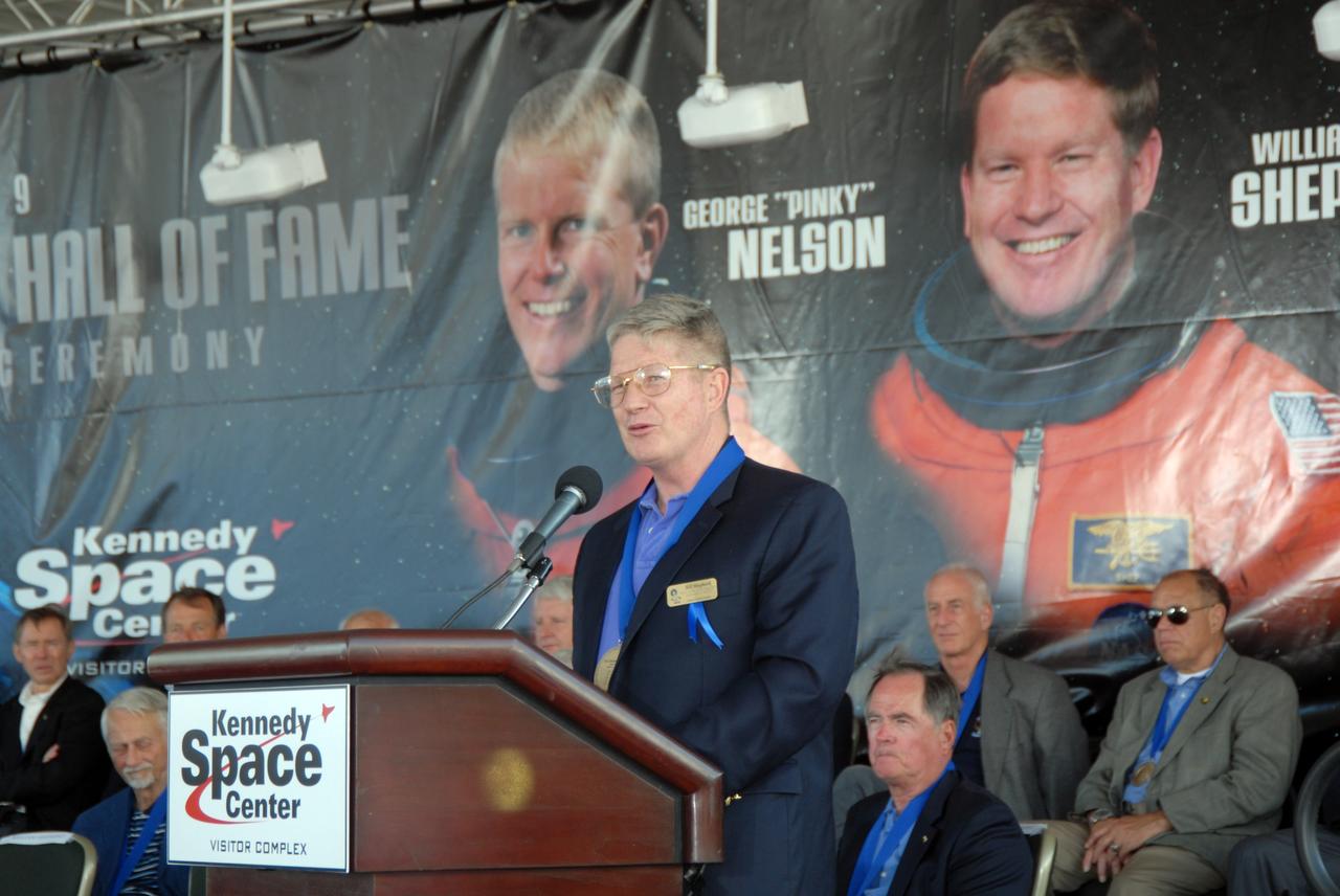 CAPE CANAVERAL, Fla. –– Astronaut William Shepherd addresses the spectators at the U.S. Astronaut Hall of Fame after his induction in the ceremony held at NASA's Kennedy Space Center Visitor Complex in Florida. Shepherd was commander of the first crew to live aboard the International Space Station.  The ceremony took place May 2. More than 20 hall of fame astronauts attended, including Scott Carpenter, Walt Cunningham, Jim Lovell and Bob Crippen. Photo credit: NASA/Jim Grossmann