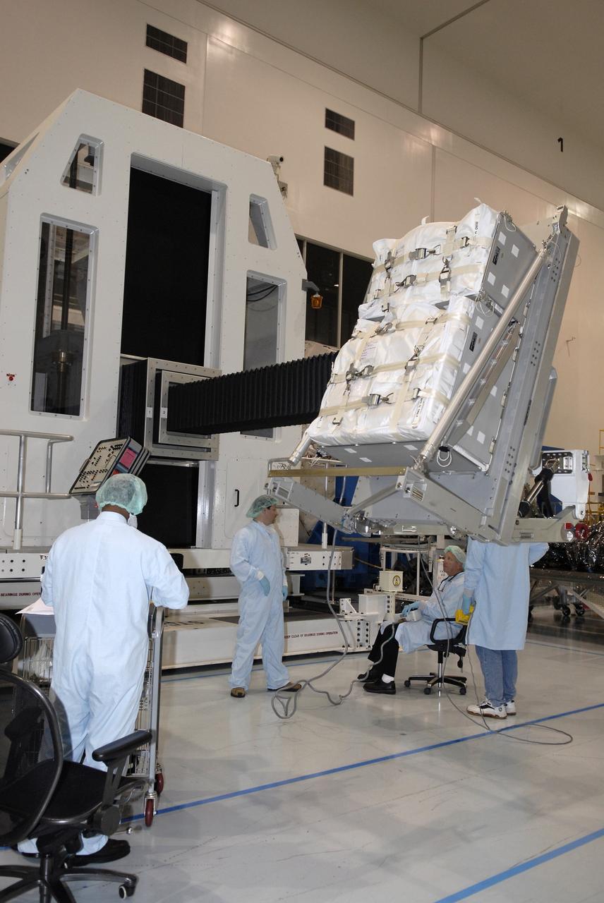 CAPE CANAVERAL, Fla. – In the Space Station Processing Facility at NASA's Kennedy Space Center in Florida, the rack insertion device lifts the Resupply Stowage Platform, or RSP, for installation in the multi-purpose logistics module Leonardo. The module is part of the payload for space shuttle Discovery's STS-128 mission. Discovery will carry science and storage racks to the International Space Station . Launch of Discovery is targeted for Aug. 6.  Photo credit: NASA/Kim Shiflett
