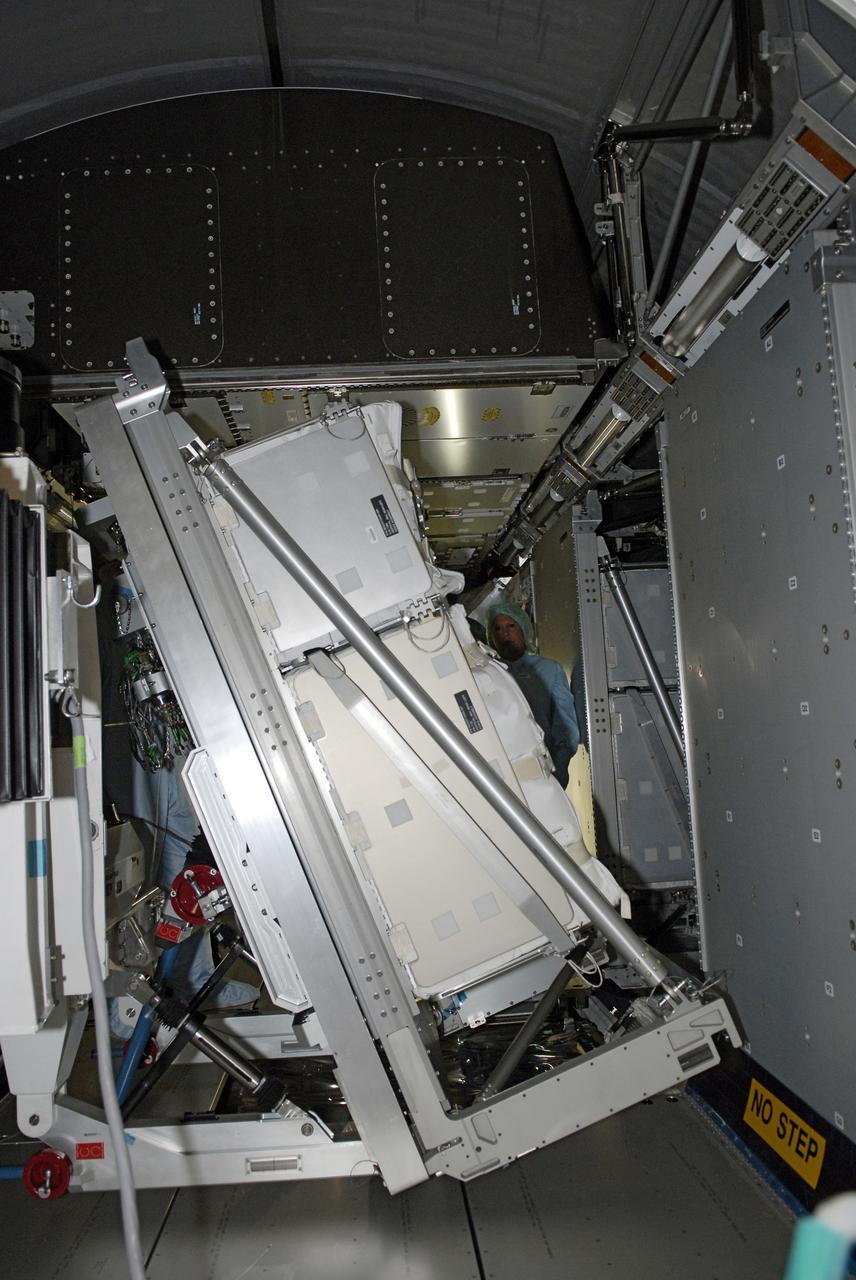 CAPE CANAVERAL, Fla. – In the Space Station Processing Facility at NASA's Kennedy Space Center in Florida,  the Resupply Stowage Platform, or RSP, is moved into the multi-purpose logistics module Leonardo. The module is part of the payload for space shuttle Discovery's STS-128 mission. Discovery will carry science and storage racks to the International Space Station . Launch of Discovery is targeted for Aug. 6.  Photo credit: NASA/Kim Shiflett