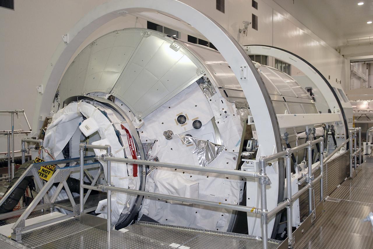 CAPE CANAVERAL, Fla. – The multi-purpose logistics module Leonardo is seen in the Space Station Processing Facility at NASA's Kennedy Space Center in Florida.  A Resupply Stowage Platform, or RSP, containing equipment was just installed inside.  The module is part of the payload for space shuttle Discovery's STS-128 mission. Discovery will carry science and storage racks to the International Space Station . Launch of Discovery is targeted for Aug. 6.  Photo credit: NASA/Kim Shiflett