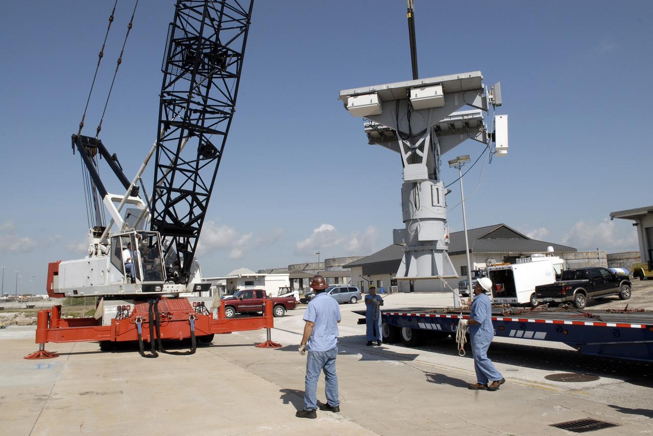 CAPE CANAVERAL, Fla. – In Port Canaveral, Fla., a crane lifts the X-band radar from its transporter to move it onto the U.S. Army landing craft utility ship Brandy Station. The radar will provide critical support during launch of space shuttle Atlantis on the STS-125 mission.  The radar will work with smaller X-band radars placed on the solid rocket booster retrieval ship Liberty Star to provide extremely high-resolution images of any debris that might be created during Atlantis' launch.  Photo credit: NASA/Kim Shiflett