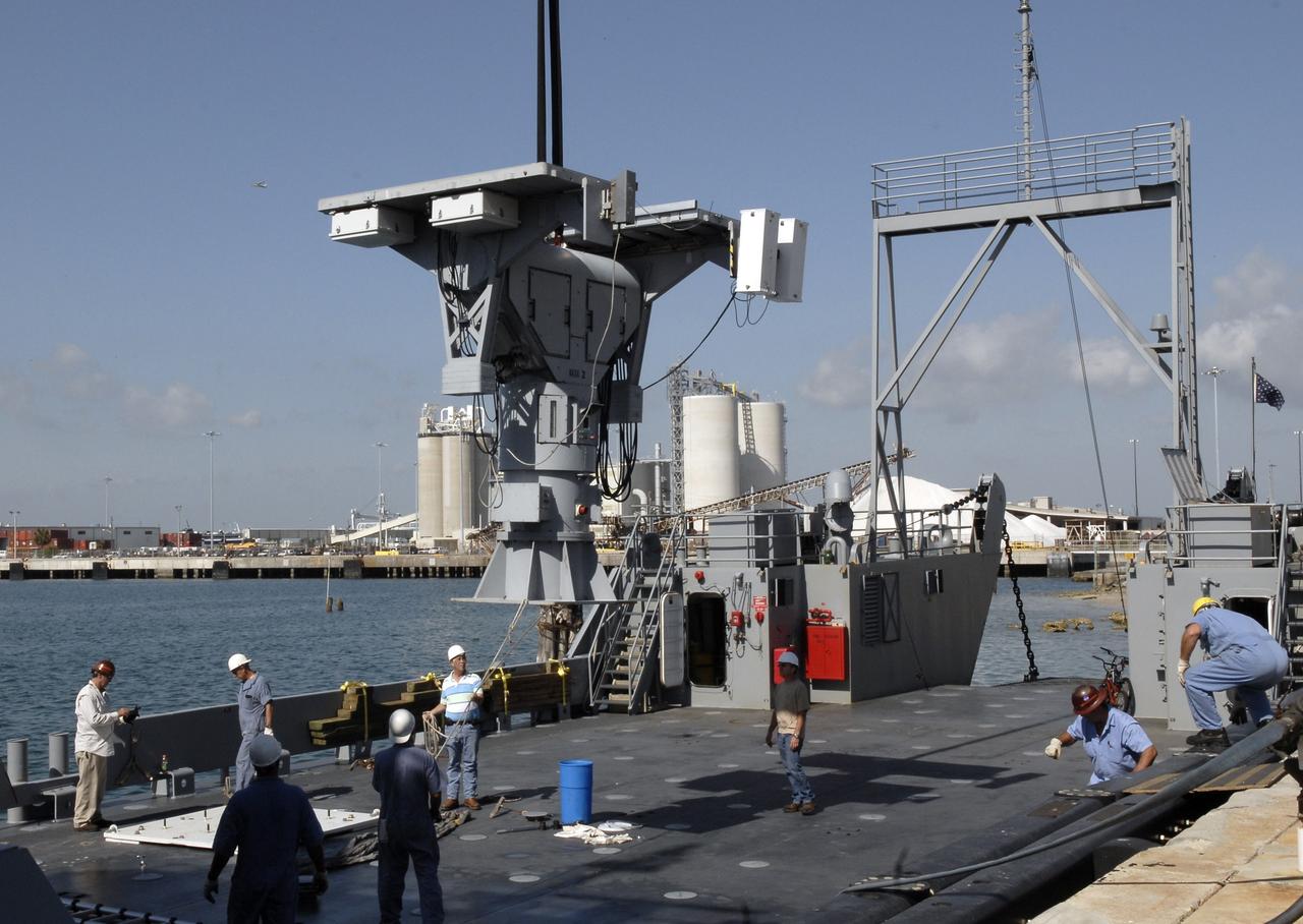 CAPE CANAVERAL, Fla. – In Port Canaveral, Fla.,  a crane lowers the X-band radar onto the U.S. Army landing craft utility ship Brandy Station. The radar will provide critical support during launch of space shuttle Atlantis on the STS-125 mission.  The radar will work with smaller X-band radars placed on the solid rocket booster retrieval ship Liberty Star to provide extremely high-resolution images of any debris that might be created during Atlantis' launch.  Photo credit: NASA/Kim Shiflett