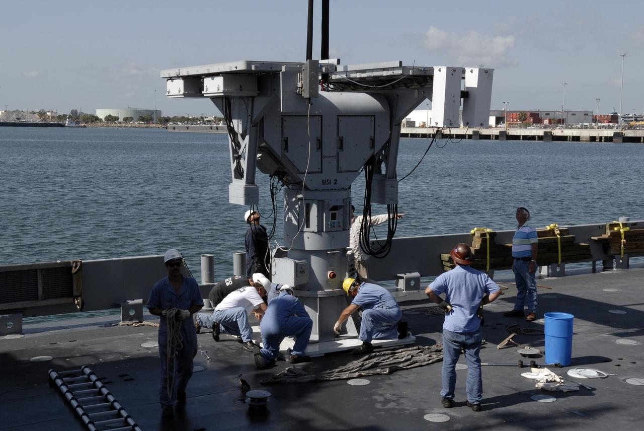 CAPE CANAVERAL, Fla. – In Port Canaveral, Fla.,  technicians help install the X-band radar on the deck of the U.S. Army landing craft utility ship Brandy Station.  The radar will provide critical support during launch of space shuttle Atlantis on the STS-125 mission.  The radar will work with smaller X-band radars placed on the solid rocket booster retrieval ship Liberty Star to provide extremely high-resolution images of any debris that might be created during Atlantis' launch.  Photo credit: NASA/Kim Shiflett