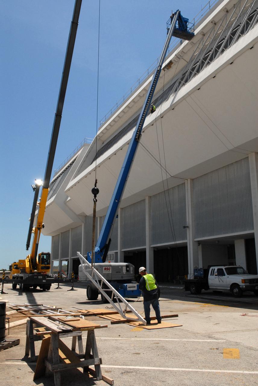 CAPE CANAVERAL, Fla. – New windows are installed in the Launch Control Center's Firing Room 1 at NASA's Kennedy Space Center in Florida. The firing room will support the future Ares rocket launches as part of NASA's Constellation Program. Future astronauts will ride to orbit on Ares I, launched from Kennedy's Launch Pad 39B. The Launch Control Center firing rooms face the launch pads. Photo credit: NASA/Jack Pfaller