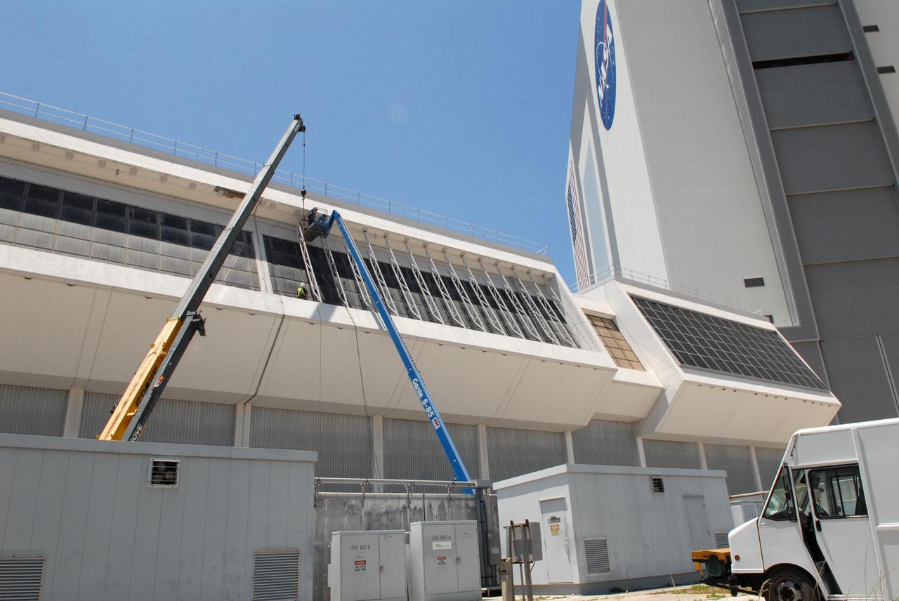 CAPE CANAVERAL, Fla. – New windows are installed in the Launch Control Center's Firing Room 1 at NASA's Kennedy Space Center in Florida. The firing room will support the future Ares rocket launches as part of NASA's Constellation Program. Future astronauts will ride to orbit on Ares I, launched from Kennedy's Launch Pad 39B. The Launch Control Center firing rooms face the launch pads. Photo credit: NASA/Jack Pfaller