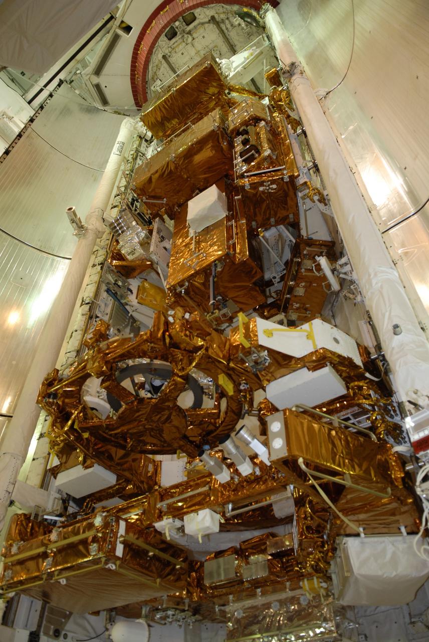 CAPE CANAVERAL, Fla. – On Launch Pad 39A at NASA's Kennedy Space Center in Florida, space shuttle Atlantis' payload bay is filled with hardware for the STS-125 mission to service NASA's Hubble Space Telescope. At the bottom are the Flight Support System with the Soft Capture mechanism and Multi-Use Lightweight Equipment Carrier with the Science Instrument Command and Data Handling Unit, or SIC&DH.  At center is the Orbital Replacement Unit Carrier with the Cosmic Origins Spectrograph, or COS, and an IMAX 3D camera. At top is the Super Lightweight Interchangeable Carrier with the Wide Field Camera 3. Atlantis' crew will service NASA's Hubble Space Telescope for the fifth and final time. The flight will include five spacewalks during which astronauts will refurbish and upgrade the telescope with state-of-the-art science instruments. As a result, Hubble's capabilities will be expanded and its operational lifespan extended through at least 2014.   Photo credit: NASA/Kim Shiflett