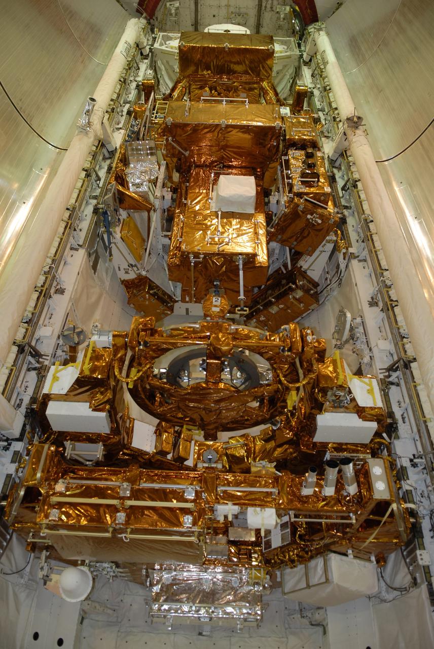 CAPE CANAVERAL, Fla. – On Launch Pad 39A at NASA's Kennedy Space Center in Florida, space shuttle Atlantis' payload bay is filled with hardware for the STS-125 mission to service NASA's Hubble Space Telescope.  At the bottom is the Flight Support System with the Soft Capture mechanism.  At center is the Orbital Replacement Unit Carrier with the Cosmic Origins Spectrograph, or COS, and an IMAX 3D camera. At top is the Super Lightweight Interchangeable Carrier with the Wide Field Camera 3.  Atlantis' crew will service NASA's Hubble Space Telescope for the fifth and final time. The flight will include five spacewalks during which astronauts will refurbish and upgrade the telescope with state-of-the-art science instruments. As a result, Hubble's capabilities will be expanded and its operational lifespan extended through at least 2014.   Photo credit: NASA/Kim Shiflett