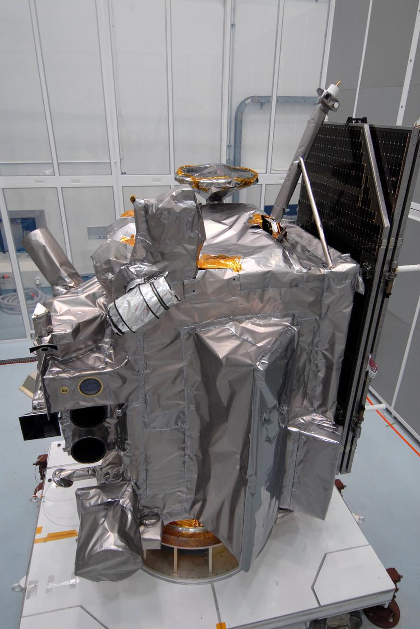 CAPE CANAVERAL, Fla. – Another view of the Lunar Reconnaissance Orbiter, or LRO, at Astrotech Space Operations in Titusville, Fla., during closeout before its mating with NASA's Lunar CRater Observation and Sensing Satellite, known as LCROSS, spacecraft. Instruments seen, at left, are (from bottom) the LEND that will measure the flux of neutrons from the moon; the LROC, a narrow angle camera that will provide panchromatic images; the LOLA, which will provide a precise global lunar topographic model and geodetic grid; and top right, the DIVINER, which will measure lunar surface temperatures at scales that provide essential information for future surface operations and exploration; and at top, the CRaTER, which will characterize the global lunar radiation environment and its biological impacts. At right is the solar panel.  The satellite's primary mission is to search for water ice on the moon in a permanently shadowed crater near one of the lunar poles. LCROSS is a low-cost, accelerated-development, companion mission to NASA's Lunar Reconnaissance Orbiter, or LRO. LCROSS and LRO are the first missions in NASA's plan to return humans to the moon and begin establishing a lunar outpost by 2020. Launch is targeted for no earlier than June 2 from Cape Canaveral Air Force Station in Florida. Photo credit: NASA/Jack Pfaller