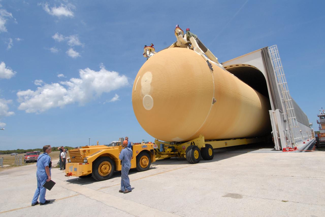CAPE CANAVERAL, Fla. – The external fuel tank, ET- 132, designated for use with space shuttle Discovery on the STS-128 mission is moved out of the Pegasus barge in the turn basin at NASA's Kennedy Space Center in Florida. It will be transported to a high bay in the Vehicle Assembly Building for checkout. On the STS-128 mission, Discovery will carry science and storage racks to the International Space Station. Launch of Discovery is targeted for Aug. 6. Photo credit: NASA/Jack Pfaller