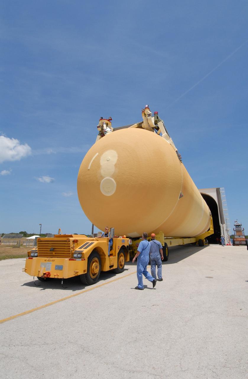 CAPE CANAVERAL, Fla. – The external fuel tank, ET- 132, designated for use with space shuttle Discovery on the STS-128 mission is moved out of the Pegasus barge in the turn basin at NASA's Kennedy Space Center in Florida. It will be transported to a high bay in the Vehicle Assembly Building for checkout. On the STS-128 mission, Discovery will carry science and storage racks to the International Space Station. Launch of Discovery is targeted for Aug. 6. Photo credit: NASA/Jack Pfaller