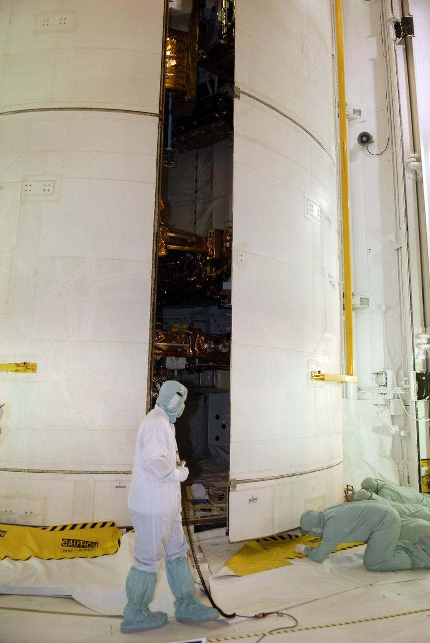 CAPE CANAVERAL, Fla. – On Launch Pad 39A at NASA's Kennedy Space Center in Florida, workers close space shuttle Atlantis' payload bay doors around the hardware for the STS-125 mission to service NASA's Hubble Space Telescope. The hardware includes the Flight Support System with the Soft Capture mechanism and Multi-Use Lightweight Equipment Carrier with the Science Instrument Command and Data Handling Unit, or SIC&DH; the Orbital Replacement Unit Carrier with the Cosmic Origins Spectrograph, or COS; an IMAX 3D camera; and the Super Lightweight Interchangeable Carrier with the Wide Field Camera 3. Atlantis' crew will service NASA's Hubble Space Telescope for the fifth and final time. The flight will include five spacewalks during which astronauts will refurbish and upgrade the telescope with state-of-the-art science instruments. As a result, Hubble's capabilities will be expanded and its operational lifespan extended through at least 2014. Launch is scheduled for 2:01 p.m. EDT on May 11. Photo credit: NASA/Kim Shiflett
