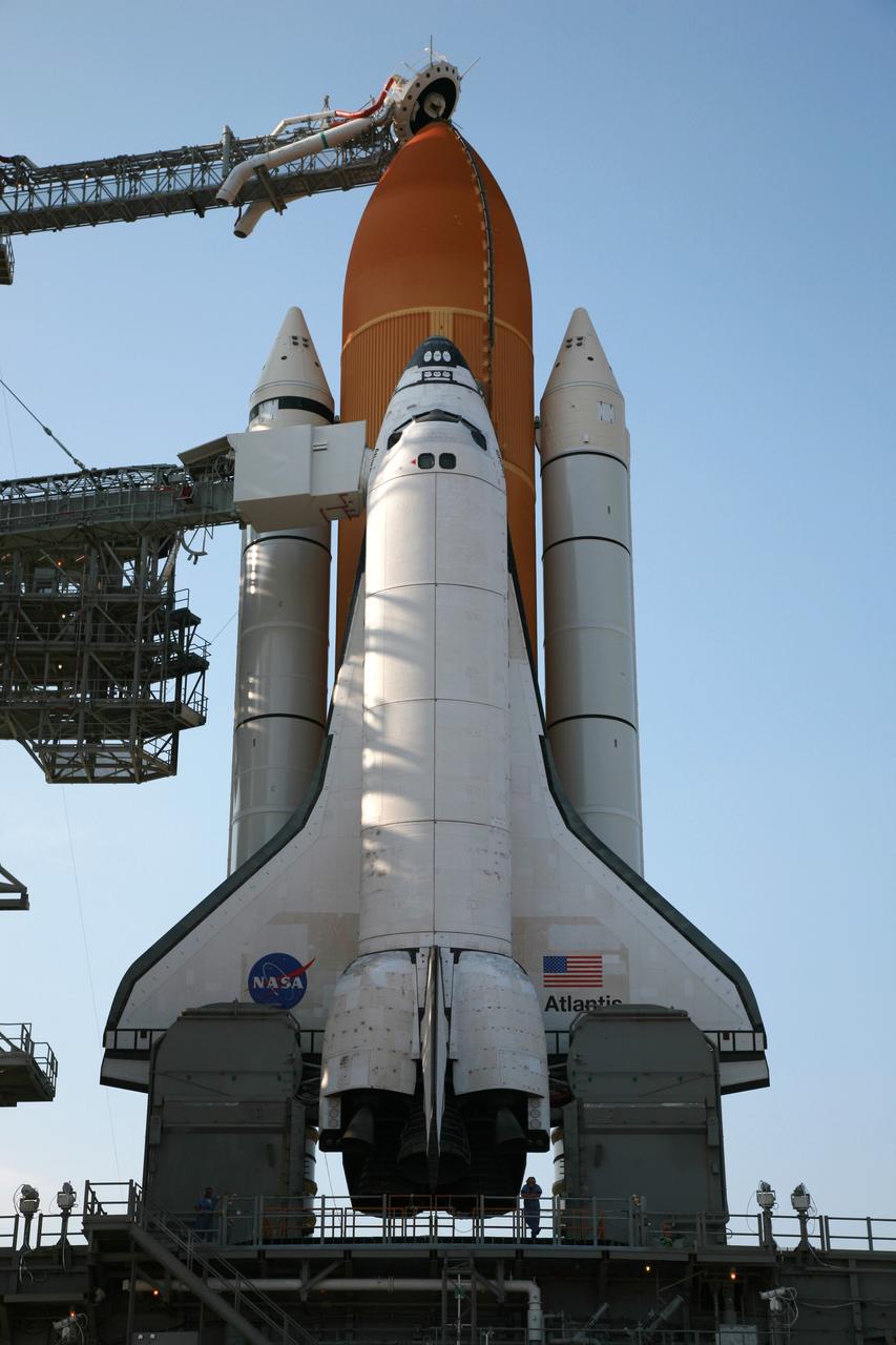 CAPE CANAVERAL, Fla. – On Launch Pad 39A at NASA's Kennedy Space Center in Florida, the oxygen vent hood, called the "beanie cap," is positioned above the external tank of space shuttle Atlantis following the rollback of the rotating service structure, or RSS. The RSS is retracted in preparation for Atlantis’ liftoff on the STS-125 mission to service NASA's Hubble Space Telescope.  The rotating structure provides protected access to the shuttle for changeout and servicing of payloads at the pad. After the RSS is rolled back, the orbiter is ready for fuel cell activation and external tank cryogenic propellant loading operations.  Atlantis' crew will service NASA's Hubble Space Telescope for the fifth and final time. The flight will include five spacewalks during which astronauts will refurbish and upgrade the telescope with state-of-the-art science instruments. As a result, Hubble's capabilities will be expanded and its operational lifespan extended through at least 2014. Launch is scheduled for 2:01 p.m. EDT on May 11.  Photo credit: NASA/Dimitri Gerondidakis