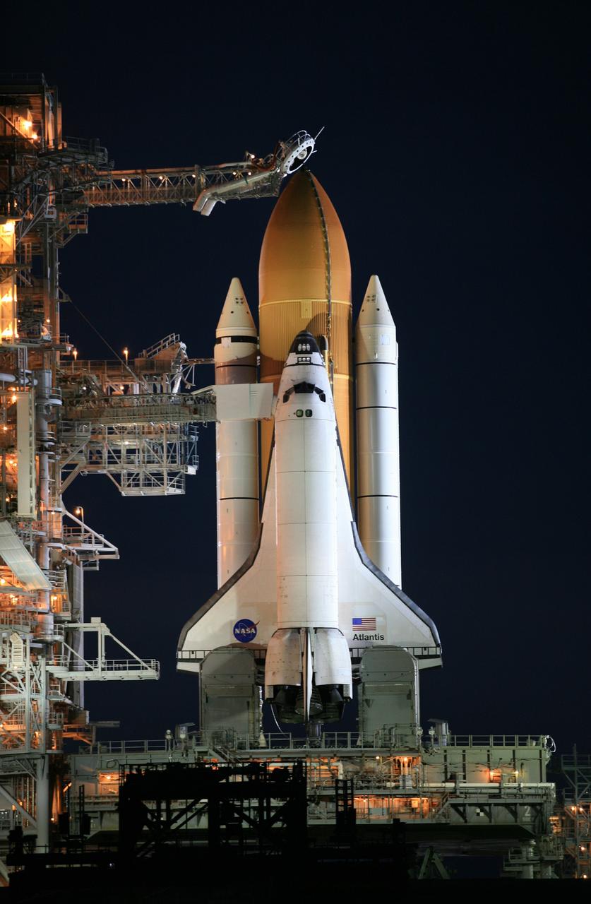 CAPE CANAVERAL, Fla. – Night falls on Launch Pad 39A at NASA's Kennedy Space Center in Florida following rollback of the pad’s rotating service structure, or RSS, from around space shuttle Atlantis.  The RSS is retracted in preparation for Atlantis’ liftoff on the STS-125 mission to service NASA's Hubble Space Telescope.  The rotating structure provides protected access to the shuttle for changeout and servicing of payloads at the pad. After the RSS is rolled back, the orbiter is ready for fuel cell activation and external tank cryogenic propellant loading operations.  Atlantis' crew will service NASA's Hubble Space Telescope for the fifth and final time. The flight will include five spacewalks during which astronauts will refurbish and upgrade the telescope with state-of-the-art science instruments. As a result, Hubble's capabilities will be expanded and its operational lifespan extended through at least 2014. Launch is scheduled for 2:01 p.m. EDT on May 11.  Photo credit: NASA/Dimitri Gerondidakis