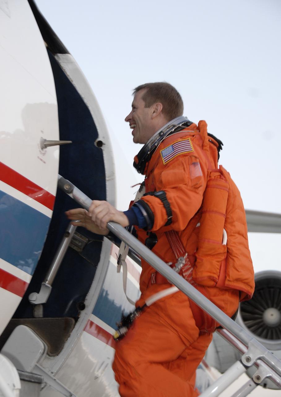 CAPE CANAVERAL, Fla. – On the Shuttle Landing Facility at NASA's Kennedy Space Center in Florida, STS-125 Pilot Gregory C. Johnson, wearing his launch-and-entry suit, heads into the Shuttle Training Aircraft to practice shuttle landings in preparation for launch of space shuttle Atlantis, scheduled for 2:01 p.m. EDT on May 11.  On Atlantis’ STS-125 mission, NASA's Hubble Space Telescope will be serviced for the fifth and final time.  The flight will include five spacewalks during which astronauts will refurbish and upgrade the telescope with state-of-the-art science instruments. As a result, Hubble's capabilities will be expanded and its operational lifespan extended through at least 2014.  Photo credit: NASA/Kim Shiflett