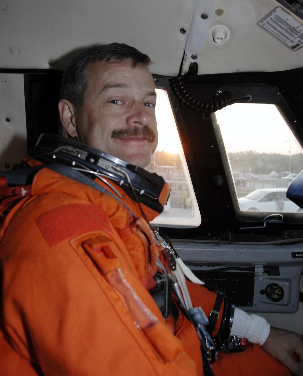 CAPE CANAVERAL, Fla. – On the Shuttle Landing Facility at NASA's Kennedy Space Center in Florida, STS-125 Commander Scott Altman, wearing his launch-and-entry suit, sits in the cockpit of the Shuttle Training Aircraft before taking off to practice shuttle landings.  He is preparing for launch of space shuttle Atlantis, scheduled for 2:01 p.m. EDT on May 11. On Atlantis’ STS-125 mission, NASA's Hubble Space Telescope will be serviced for the fifth and final time.  The flight will include five spacewalks during which astronauts will refurbish and upgrade the telescope with state-of-the-art science instruments. As a result, Hubble's capabilities will be expanded and its operational lifespan extended through at least 2014.  Photo credit: NASA/Kim Shiflett